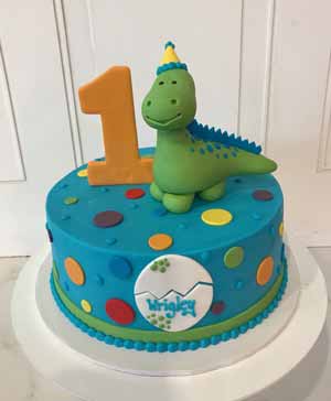 torta a tema dinosauri in pasta di zucchero per bambino di 1 anno